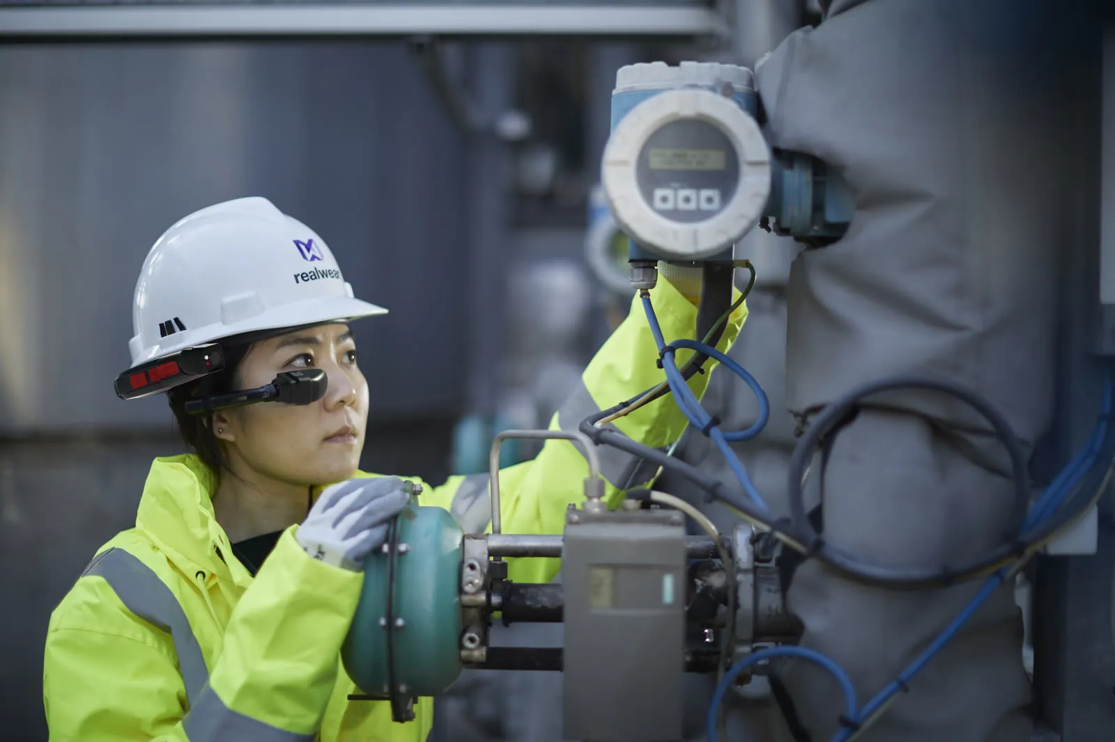 Worker in PPE at an industrial site