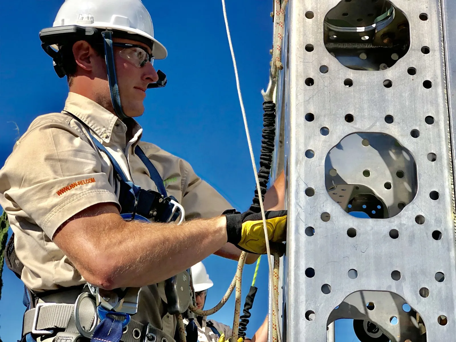 Technician working at height in an industrial environment